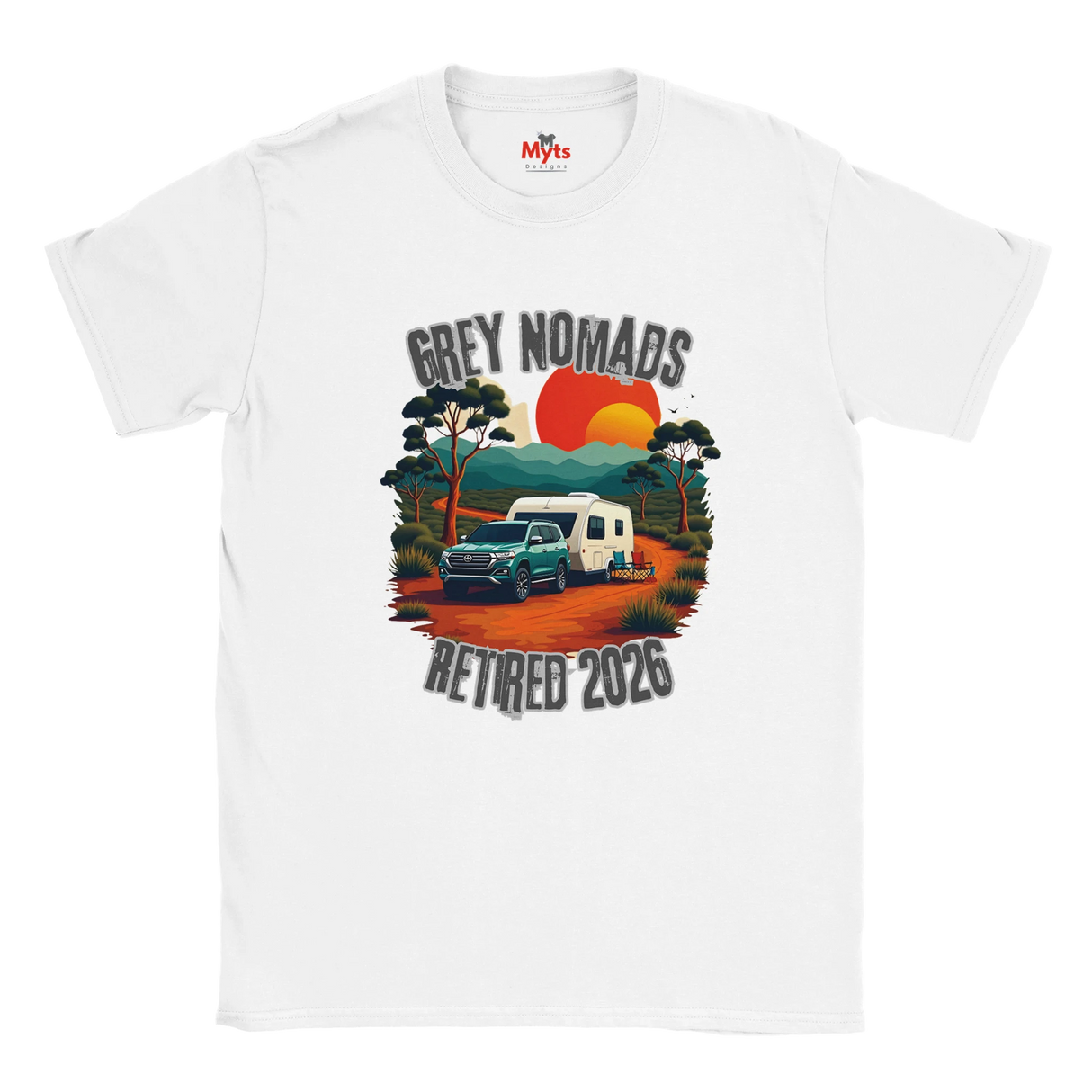 A white short-sleeve crewneck t-shirt featuring a retro-style graphic print of a grey pickup truck and a white camper van on an orange dirt road, with the text 'GREY NOMADS RETIRED 2026' and a sunset background.