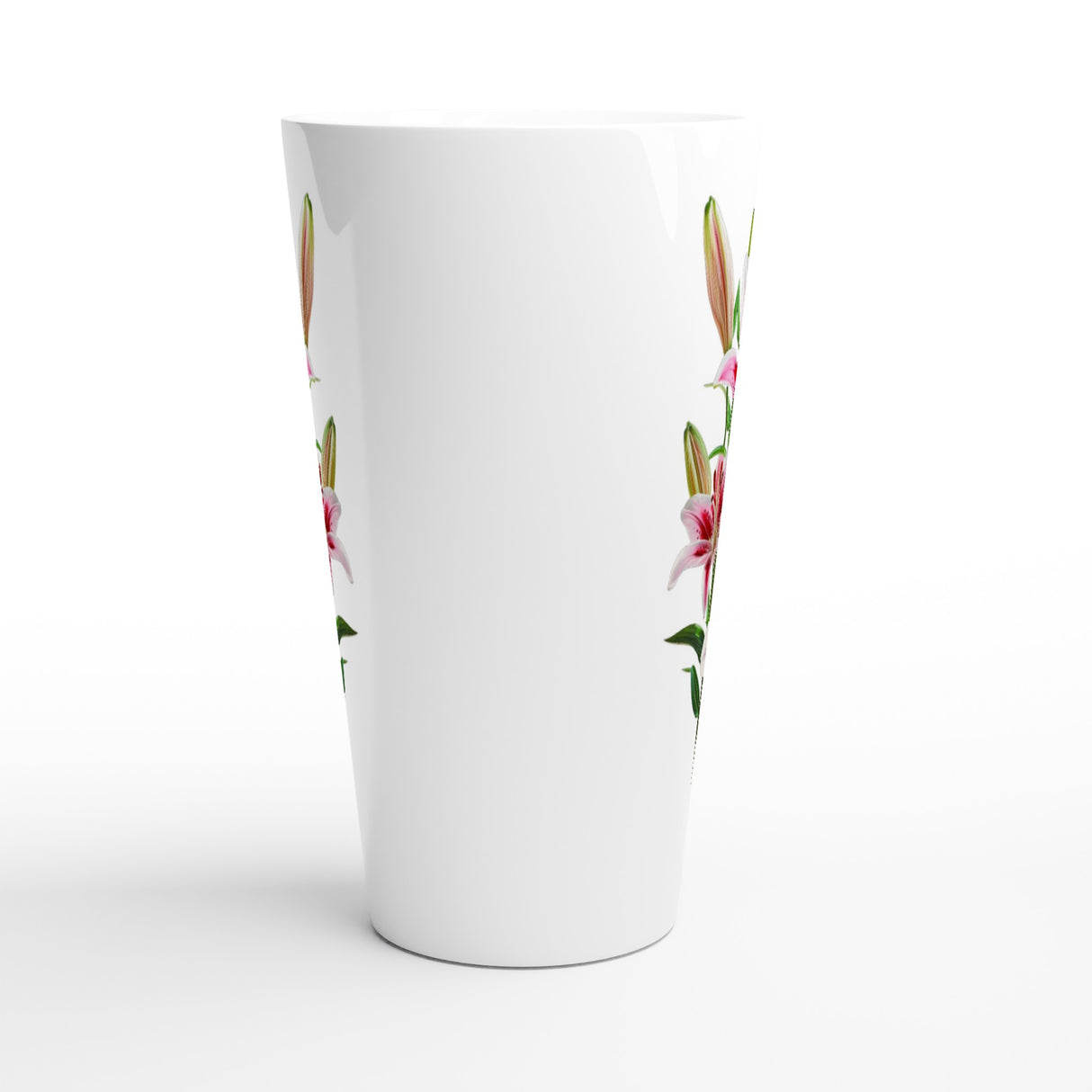 A tall white tapered glass with a delicate pink and green floral pattern printed along the sides, shown on a clean white background.