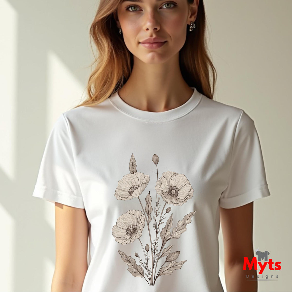 A woman wearing a white crew-neck t-shirt with a beige poppy floral graphic on the front, set against a warm beige background with soft window shadows.