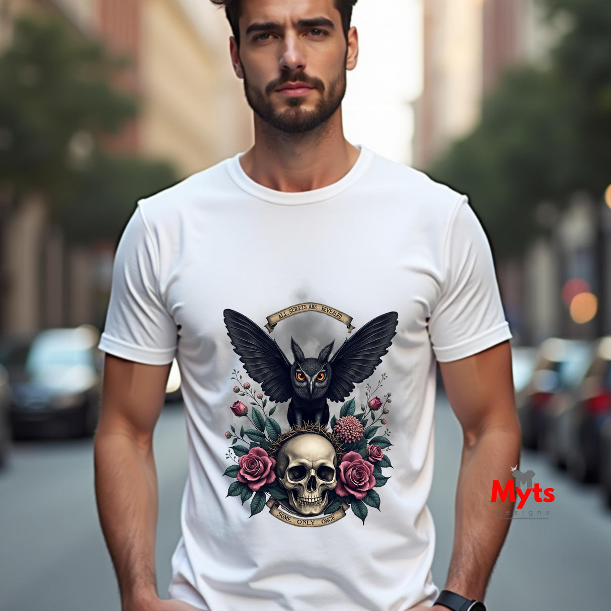 Man wearing a white t-shirt with a black owl and skull design on a city street.