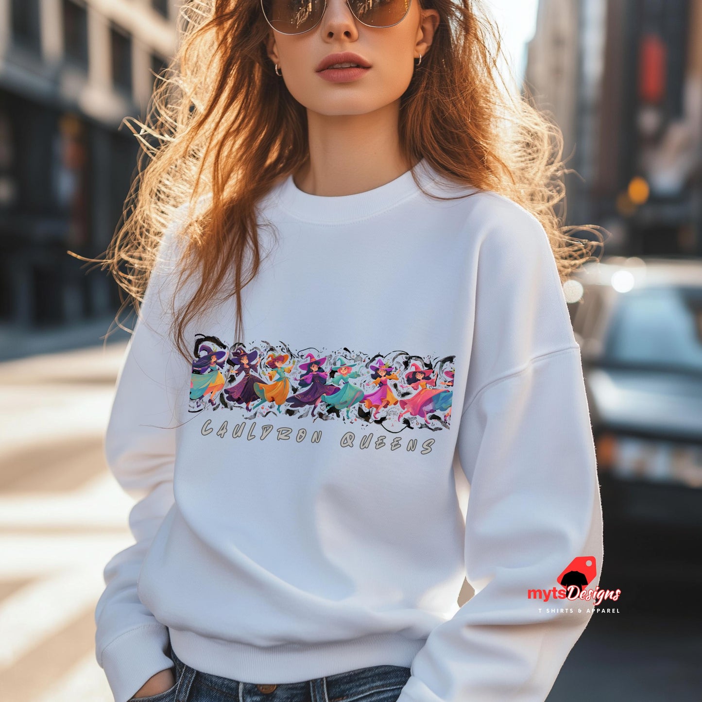 Person wearing a white sweatshirt with colorful floral design and text, standing on a street.