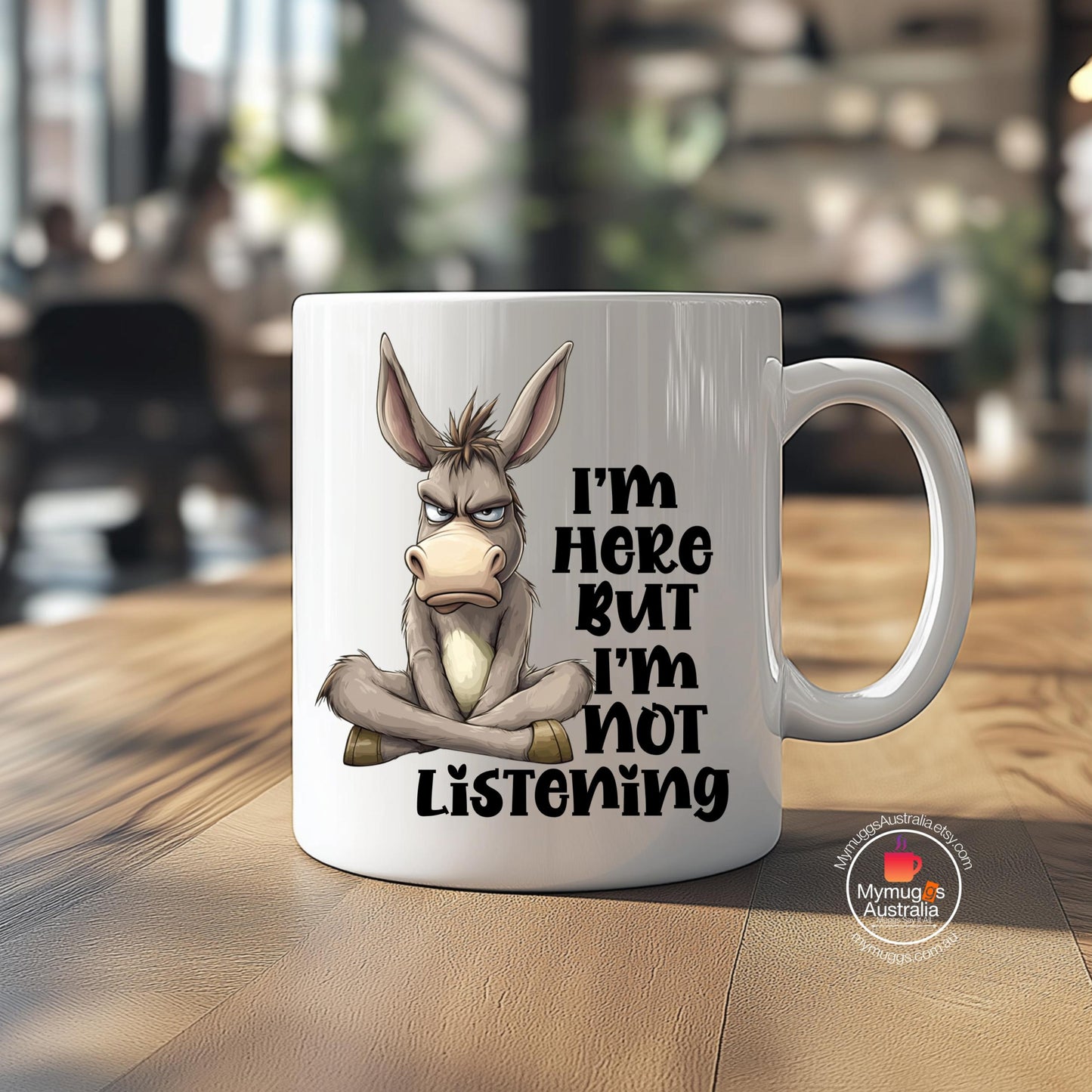 Funny “I’m Here But I’m Not Listening” donkey mug. Perfect sarcastic gift for coworkers, coffee lovers, and anyone sick of small talk. 11oz ceramic, Aussie-made.