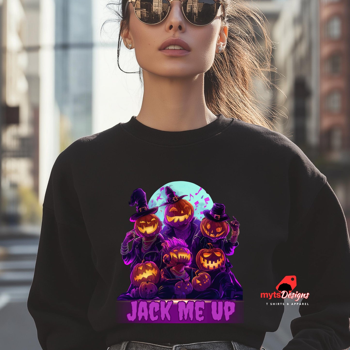 Person wearing a black sweatshirt with Halloween-themed design and 'mytsDesigns' logo.