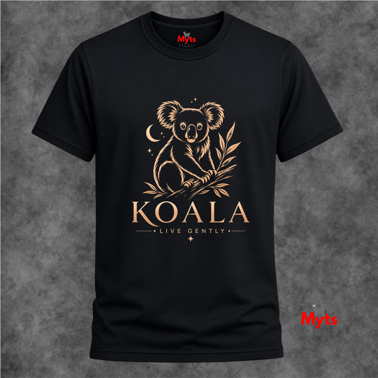 A black short-sleeve crewneck t-shirt featuring a gold line art graphic of a koala sitting on a eucalyptus branch, with the text 'KOALA' and 'LIVE GENTLY' printed below. The shirt is displayed against a textured gray background, with a red 'Myta' brand logo visible on the inner neck label and as a watermark in the bottom right corner.