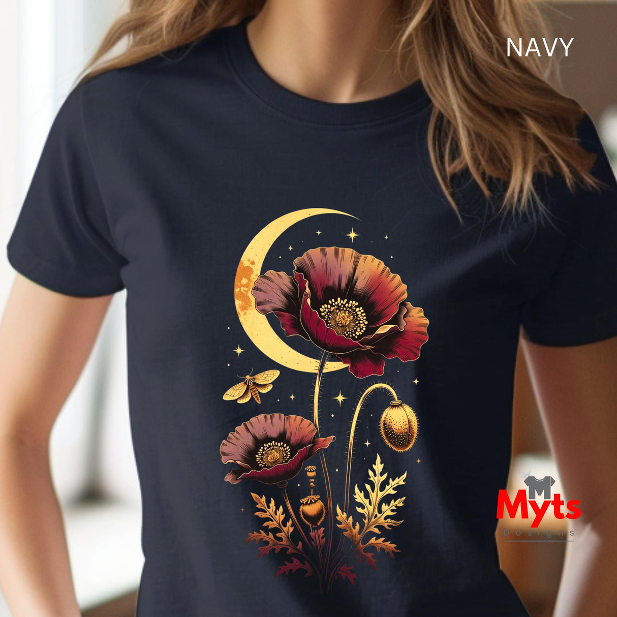 A person wearing a navy short-sleeve T-shirt with a large fantasy-style chest graphic featuring red poppy flowers, a gold crescent moon, stars, and a bee. The word "NAVY" appears in the top right, and a red "Myts" logo watermark is visible near the bottom right.