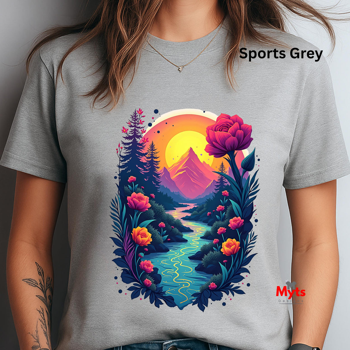 Gray t-shirt with a colorful nature graphic design featuring mountains, flowers, and a sunset.