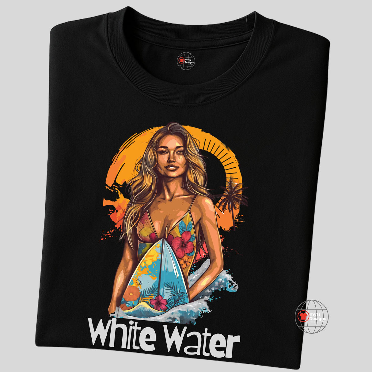 A folded black T-shirt featuring a vibrant illustration of a confident woman in a floral bikini holding a surfboard with ocean waves and an orange tropical sunset in the background. Below the graphic is the text “White Water.”