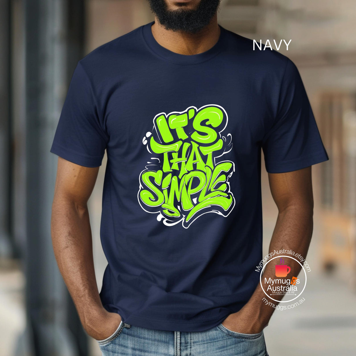 A man wearing a black T-shirt featuring groovy 60s-style “It’s That Simple” psychedelic text design – printed on soft cotton