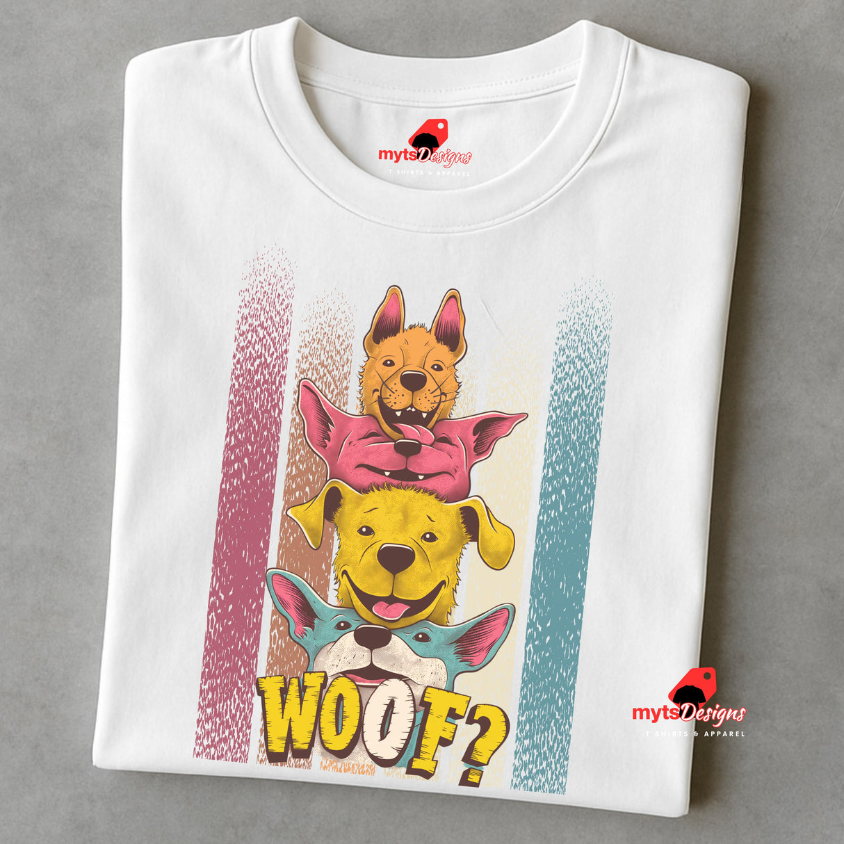 A folded white T-shirt featuring a playful graphic of four stacked colorful dogs in yellow, red, and blue tones with the word “Woof?” in bold, cartoonish text below.