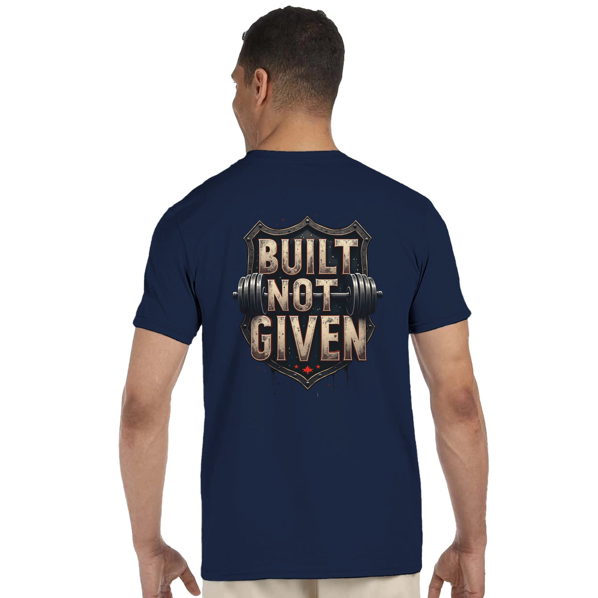 Man wearing a navy blue t-shirt with 'Built Not Given' text and barbell graphic on the back.