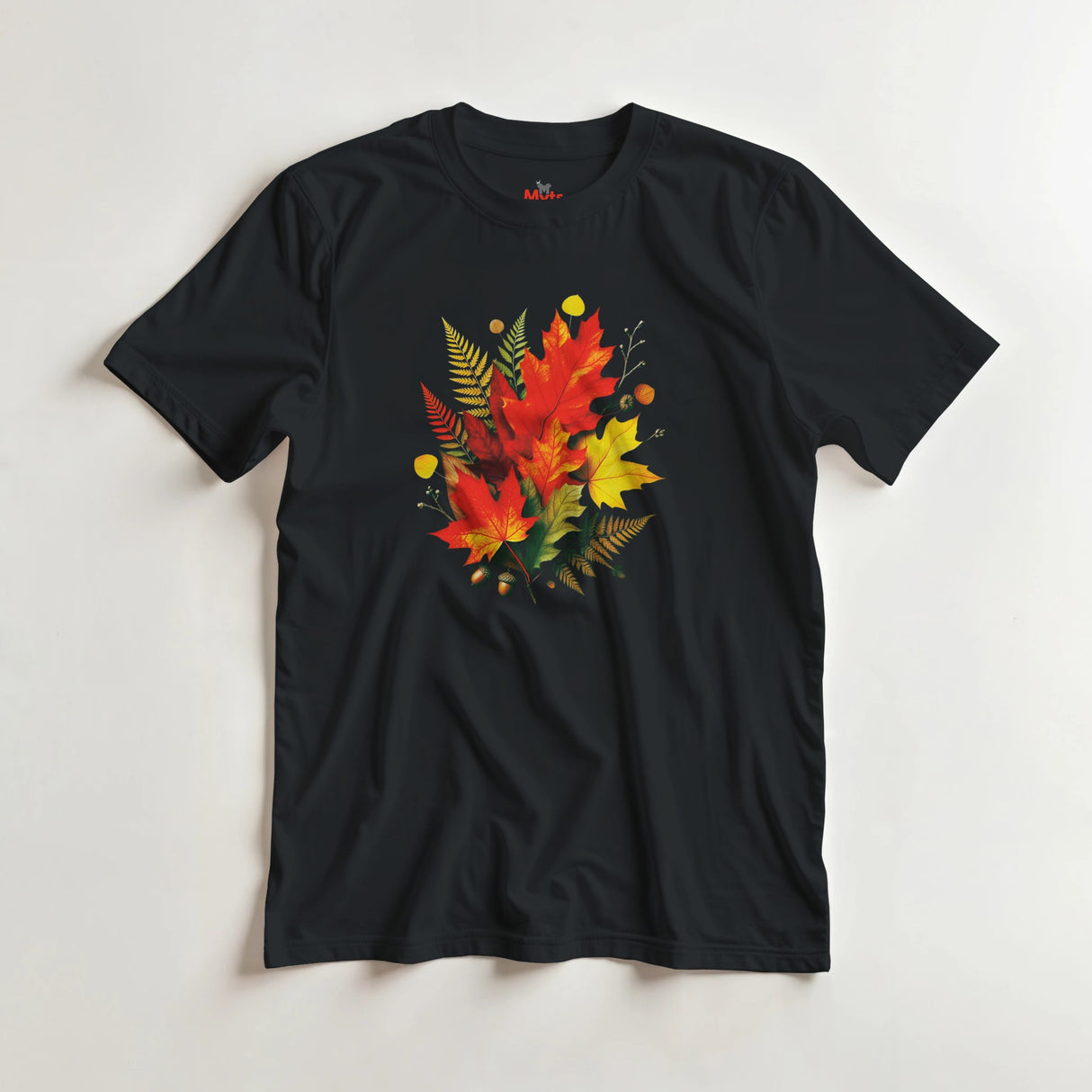Black t-shirt with autumn leaf design on a light gray background