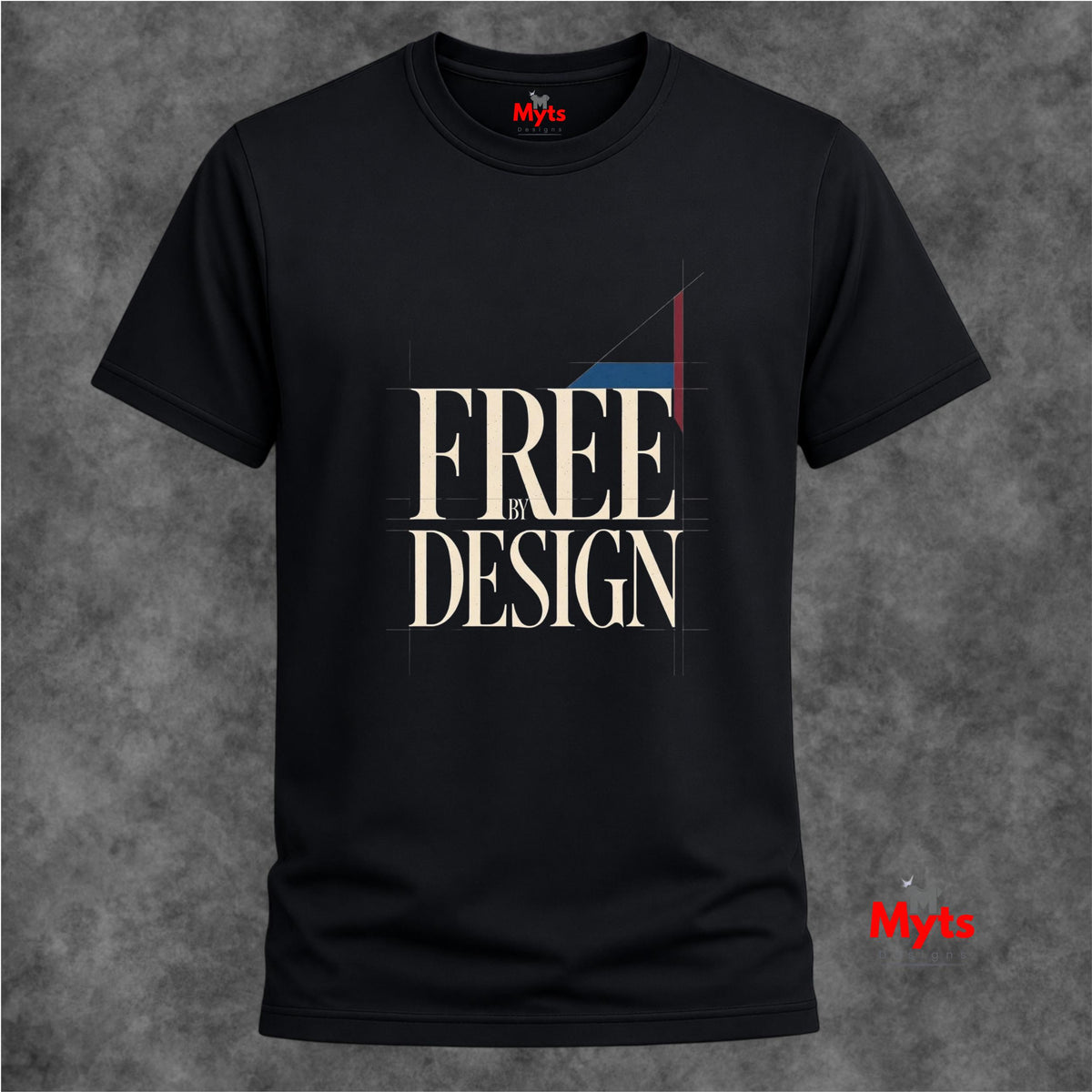 A black short-sleeve T-shirt with a graphic print reading 'FREE BY DESIGN' in beige, white, and red, displayed against a textured gray background.