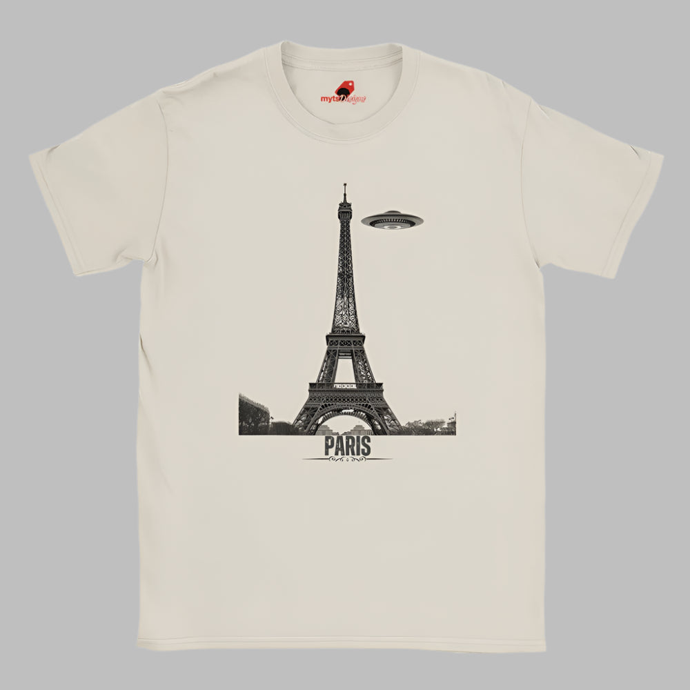 Front view of a white soft casual tee featuring a whimsical graphic of the Eiffel Tower with a retro‑style spaceship orbiting it, printed on ultra‑soft Gildan 64000 cotton.