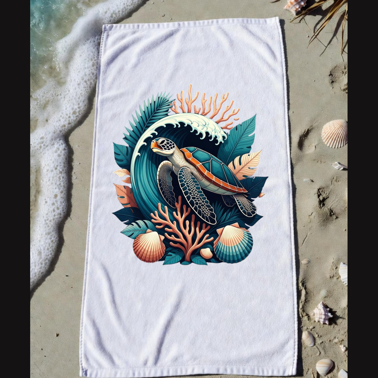 A white beach towel laid flat on sandy shore with ocean foam and seashells around it. The towel features a large colorful sea turtle illustration surrounded by coral, leaves, and shells.