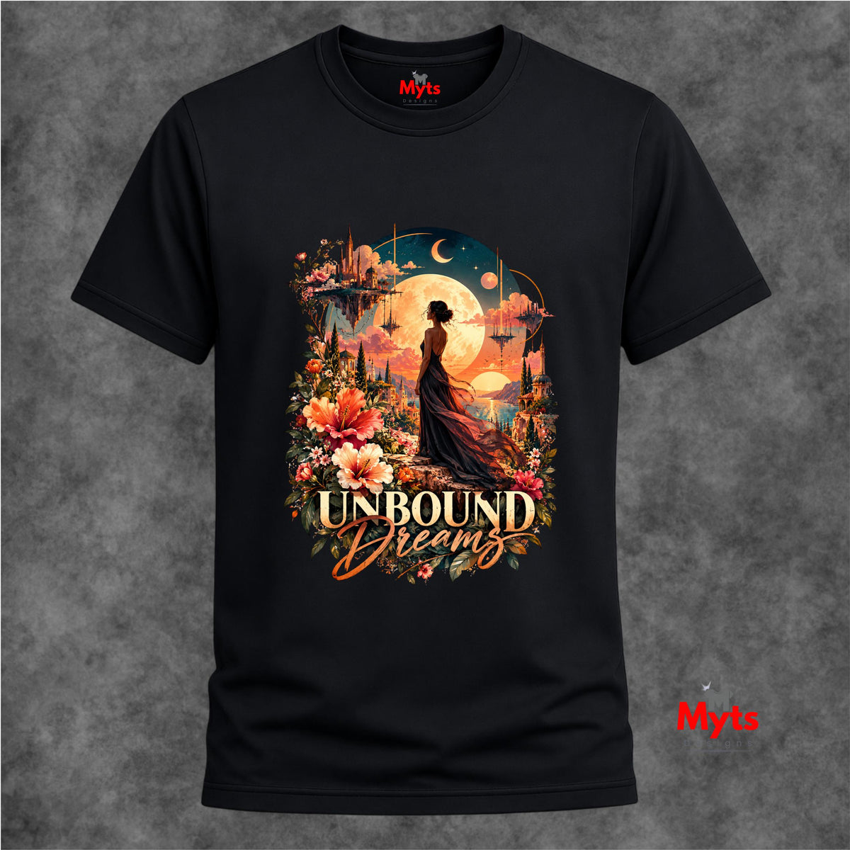 Black Unbound Dreams graphic T-shirt displayed against a textured grey studio background.