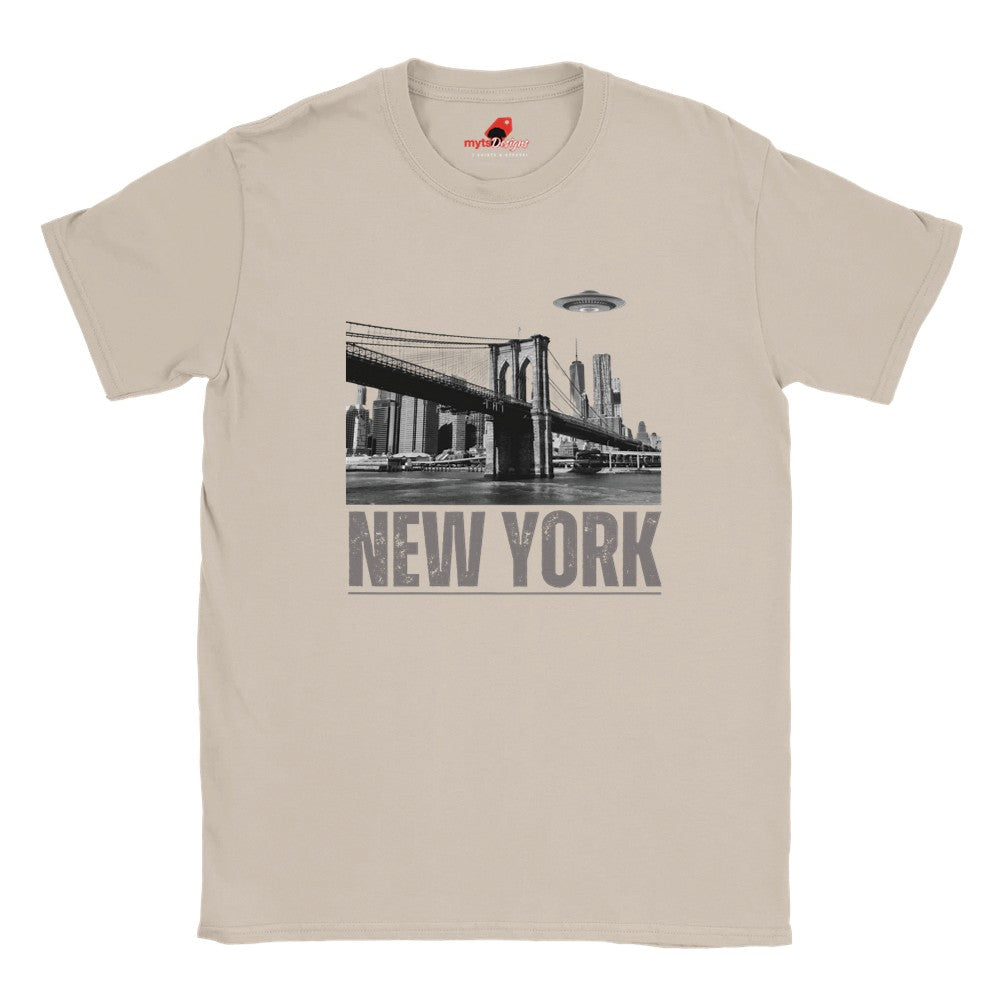 Sand colored soft casual tee showing the New York City skyline with a stylized spaceship graphic soaring above, printed on ultra-soft Gildan 64000 cotton.