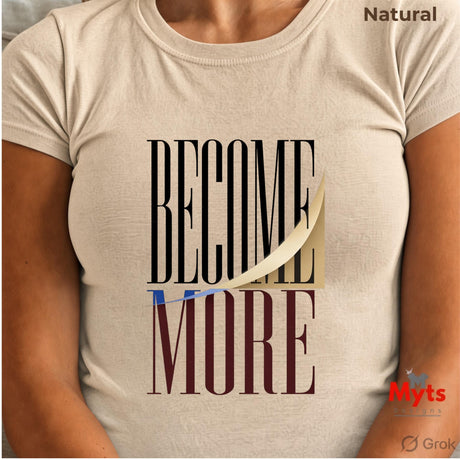 A person wearing a natural short-sleeve T-shirt with a graphic print that reads 'BECOME MORE' in black and dark burgundy lettering with a gold ribbon detail. The text 'Natural' is visible in the top right, and 'Myts' and 'Grok' logos are in the bottom right.