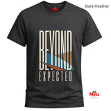 A dark heather gray t-shirt with a graphic print that reads 'BEYOND EXPECTED' in beige, blue, and brown, displayed on a clean white background with brand and color labels.