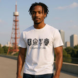 Man wearing a white t-shirt with medieval-inspired crests, helmet, goblet, and shield graphic design with the text “Knights of Olde.” Perfect for history buffs and fantasy fans.