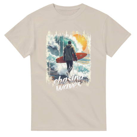 Sand t-shirt with a graphic of a person holding a surfboard and text 'chasing waves' on a white background