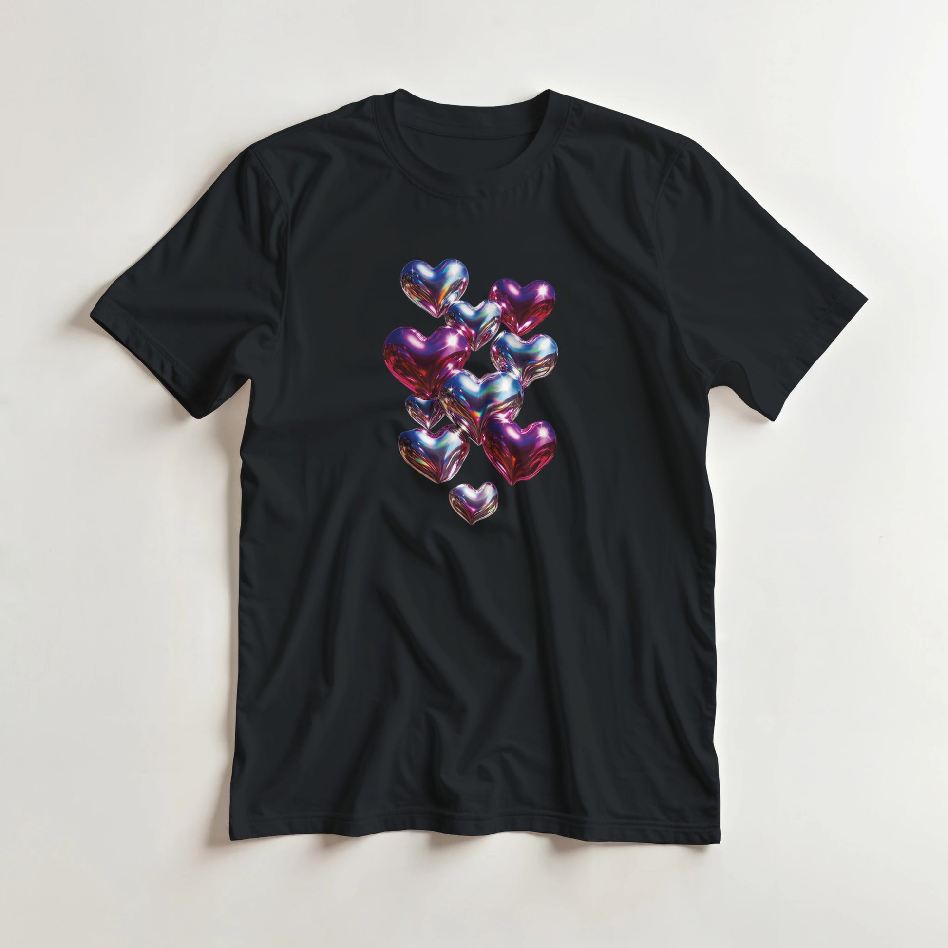 Black t-shirt with colorful heart design on a light gray background