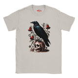 A Ice Grey crewneck t-shirt featuring a gothic-style graphic print of a black raven perched on a skull, surrounded by red roses, keys, and bells. The brand name 'Myts' is printed in red on the inside neck label.