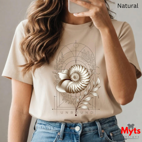  “Woman wearing a natural Unbound Nautilus shell graphic T-shirt outdoors.”