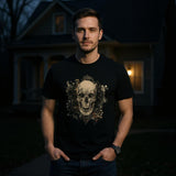 Man wearing a black t-shirt with a skull design in front of a house at night.