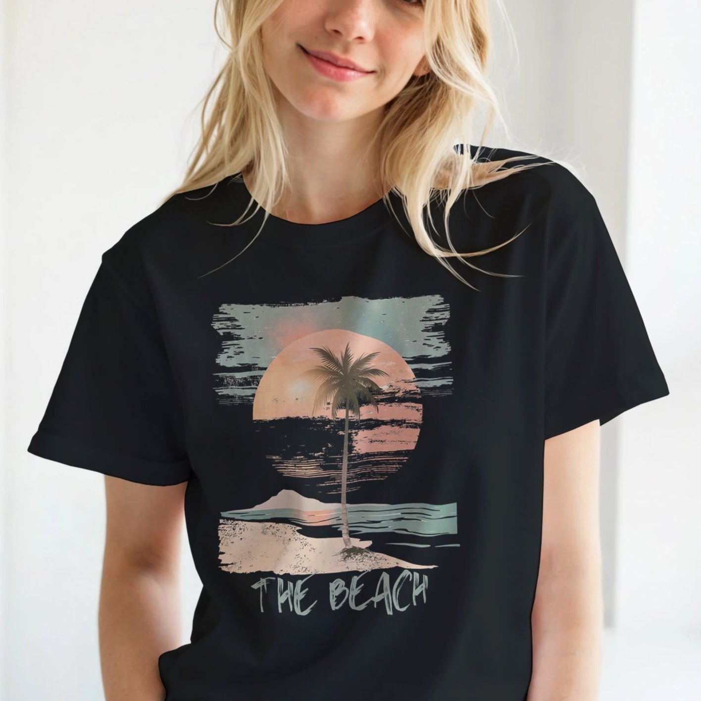 Close-up detail of distressed palm tree and sunset illustration – soft cotton fabric worn by a young girl