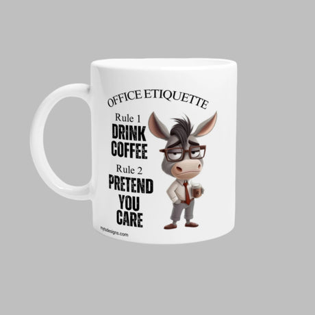 A white ceramic coffee mug with a glossy finish, featuring a humorous donkey character in glasses and a black shirt, surrounded by text that reads 'Office Etiquette', 'Drink Coffee', and 'You Care'. The mug is designed with a vivid print that maintains its quality over time.