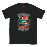A black short-sleeve t-shirt with a retro-style graphic on the front showing a grey pickup truck and camper van camping under a sunset, with the text 'GREY NOMADS RETIRED 2026'.