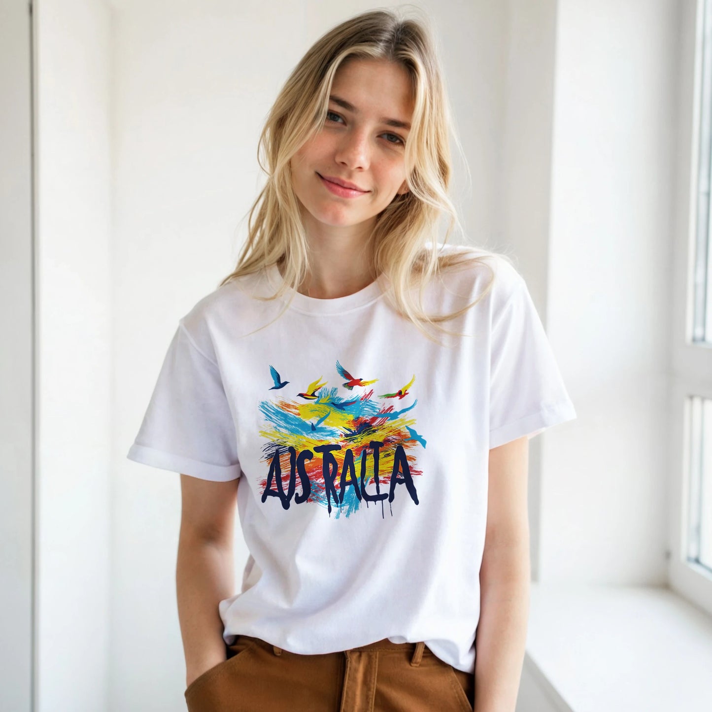 Person wearing a white t-shirt with 'Australia' and colorful designs.