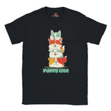 A flat lay black T-shirt featuring a colorful graphic of four stacked cartoon puppies in teal, orange, cream, and yellow shades with the words “Puppy Love” in playful green text below


