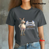 Woman wearing a Dark Heather funny donkey gym T-shirt with Fitness Level Still Trying print and blue jeans.