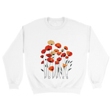 A white sweatshirt featuring a minimalist poppy flower design. The graphic displays red, orange, and muted gold poppies with slender stems and leaves, and the word “POPPiES” printed beneath. The cozy, casual outfit has a soft, modern aesthetic ideal for floral and nature-inspired fashion.