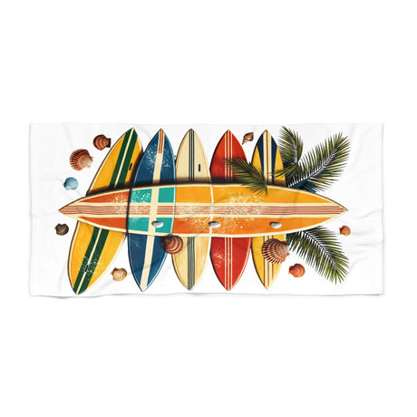 Towel with colorful surfboard design and palm leaves on a white background