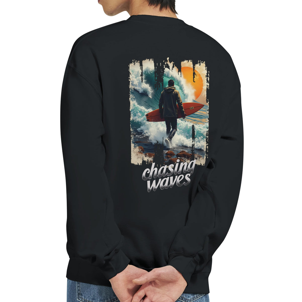 Black sweatshirt with a graphic of a person with a surfboard and 'chasing waves' text on the back.