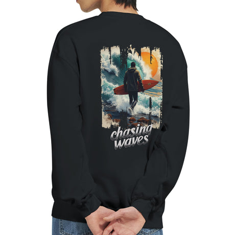 Black sweatshirt with a graphic of a person with a surfboard and 'chasing waves' text on the back.