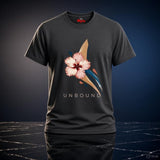 Dark Heather UNBOUND hibiscus T-shirt with pink flower and blue and gold abstract artwork against a dramatic studio background.