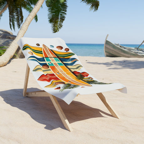 Colorful towel with wave design on a beach chair, palm trees, and ocean in the background