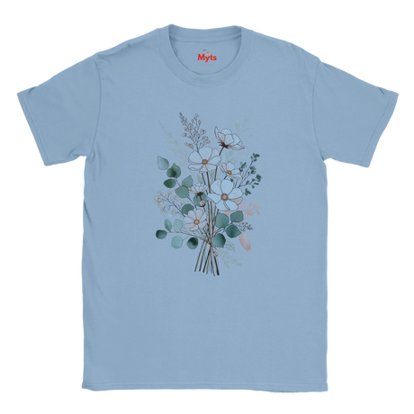 A light blue short-sleeve crewneck t-shirt featuring a central graphic of a watercolor-style floral bouquet with green, white, and peach blossoms. The brand name 'Myts' is printed in red on the inside neck label.