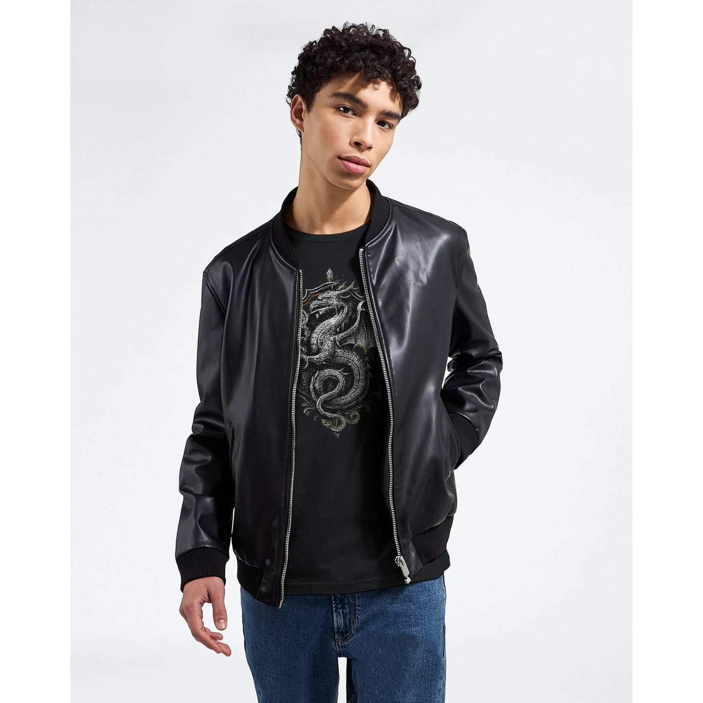 Person wearing a black leather jacket and black t-shirt with a dragon design on a white background