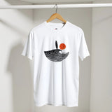 White t-shirt with a black and red design on a hanger against a white wall