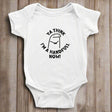 A white short sleeve bodysuit for babies with the text 'YA THINK I'M A HANDFUL NOW!' printed on the front.