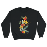 A black sweatshirt featuring an artistic watercolor floral design with red, yellow, and orange wildflowers accented by lush green leaves and delicate splatters.

