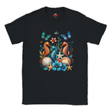 A black graphic T-shirt featuring three colourful seahorses, blue butterflies, tropical flowers, starfish and seashells in a vibrant ocean wildlife design.