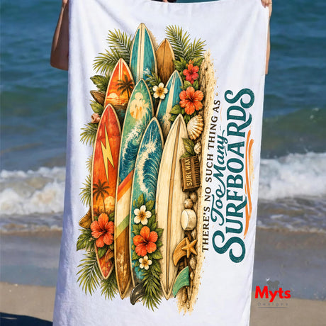 Beach towel with surfboard design and text on a beach background