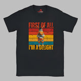 Casual tee displaying a retro-style donkey illustration with bold “First of All, I’m a Delight” vintage text, printed on ultra-soft Gildan 64000 cotton.

