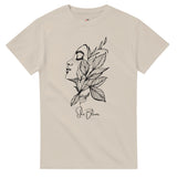 Sand t-shirt with a black floral and face design on a white background