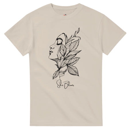 Sand t-shirt with a black floral and face design on a white background
